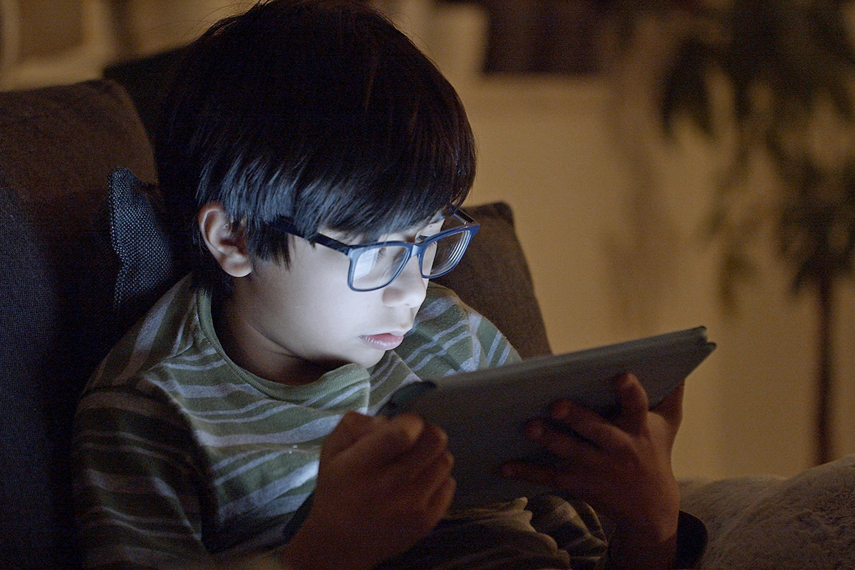 child looking at tablet
